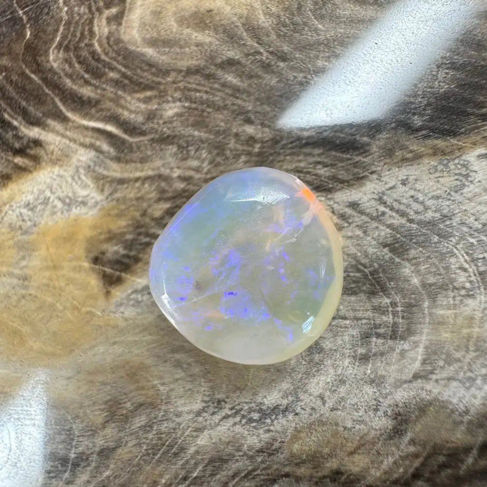 Polished Lightning Ridge Opal 4.7 carats showing blue and orange iridescence