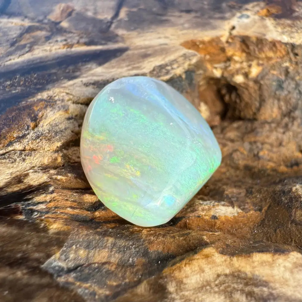 Polished Lightning Ridge Opal gemstone with iridescent play-of-color in a 7.3-carat hand-cut display