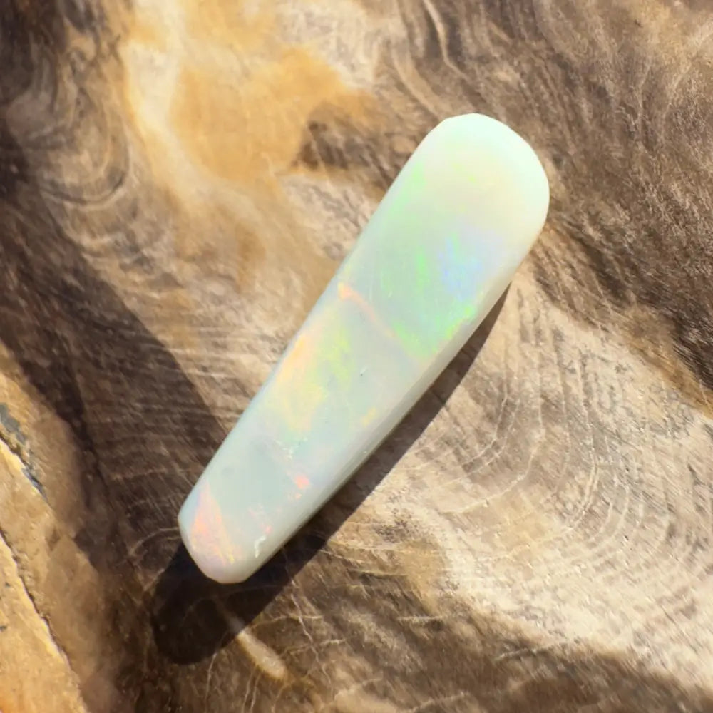 Iridescent white opal cabochon in the Hand-Cut Solid Lightning Ridge Opal 7.5 carats