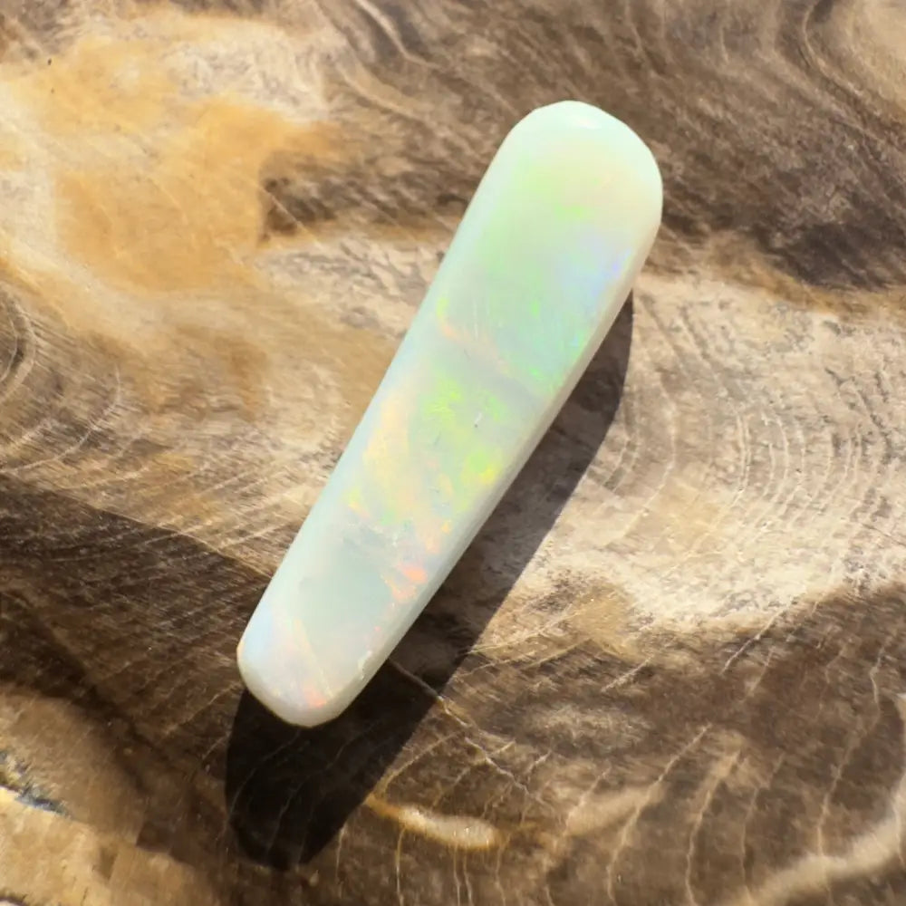 Elongated opal cabochon from Lightning Ridge in a 7.5 carat hand-cut solidopal display