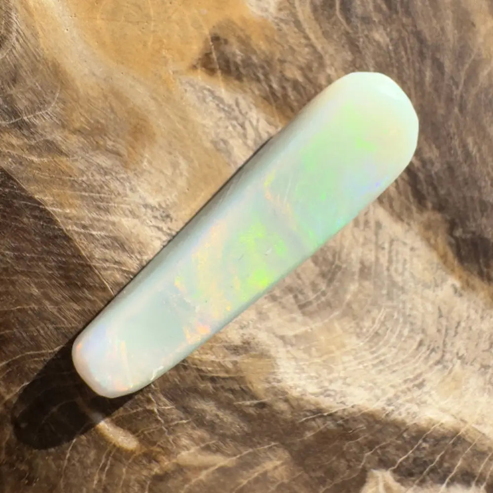 Iridescent white opal cabochon displayed in a Hand-Cut Solid Lightning Ridge Opal 7.5carat