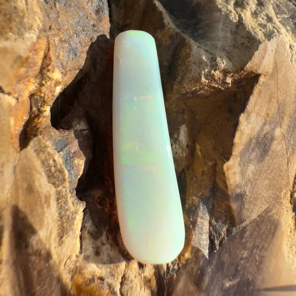 Elongated iridescent white opal in the Hand-Cut Solid Lightning Ridge Opal 7.5 carats