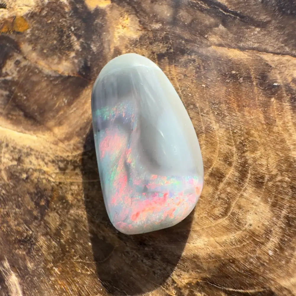 Polished Lightning Ridge Semi Black Opal with iridescent colors in a 2.8-carat hand-cut specimen