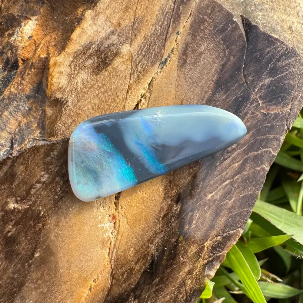Iridescent blue-gray opal cabochon in the Hand-Cut Solid Lightning Ridge Semi Black Opal 2.9carat