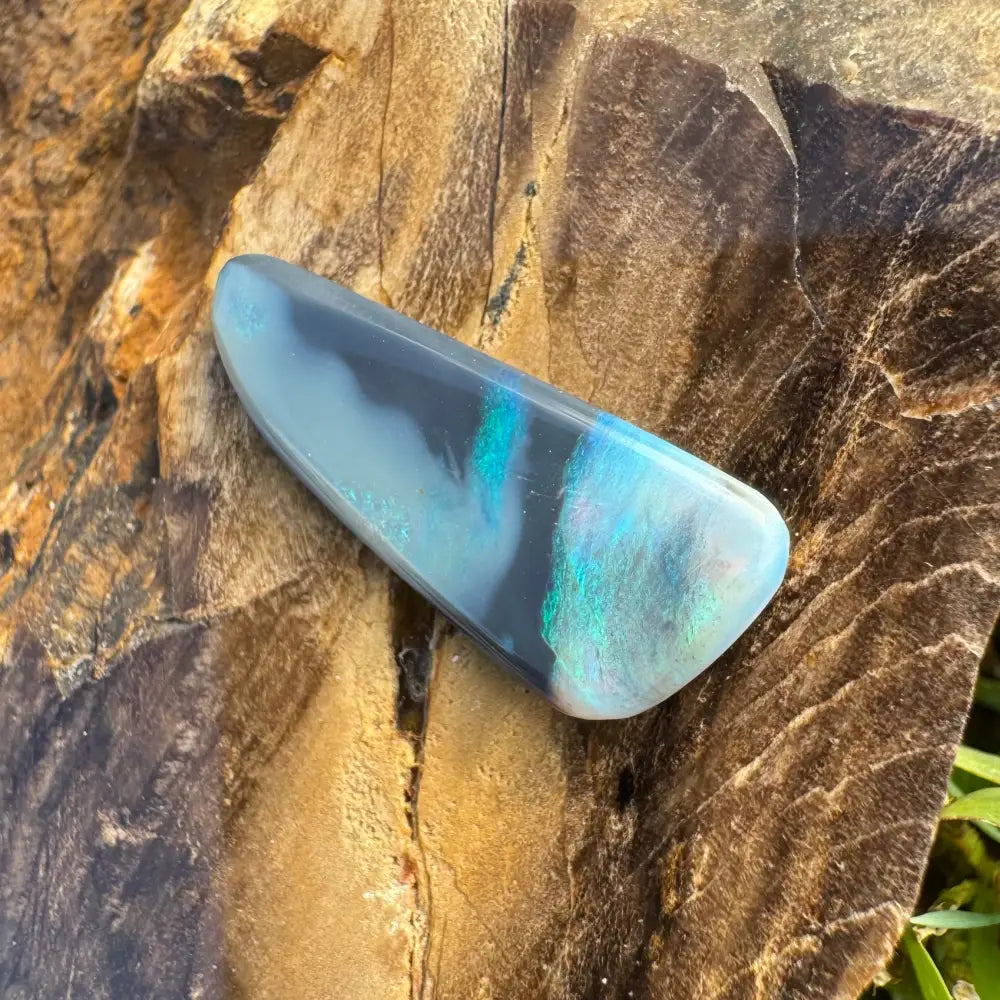 Polished Lightning Ridge Semi Black Opal with blue and green iridescence, weighing 2.9 carats