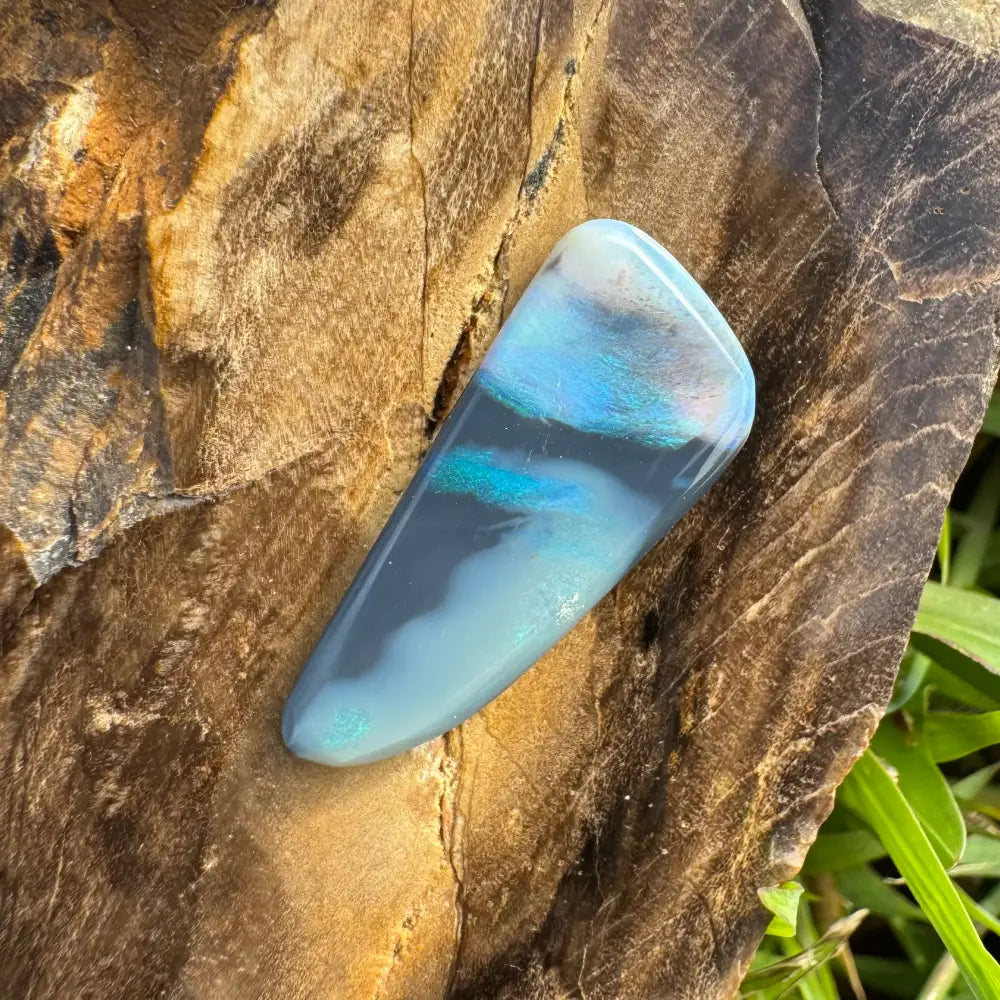 Polished iridescent blue and gray Lightning Ridge Semi Black Opal 2.9 carat gemstone