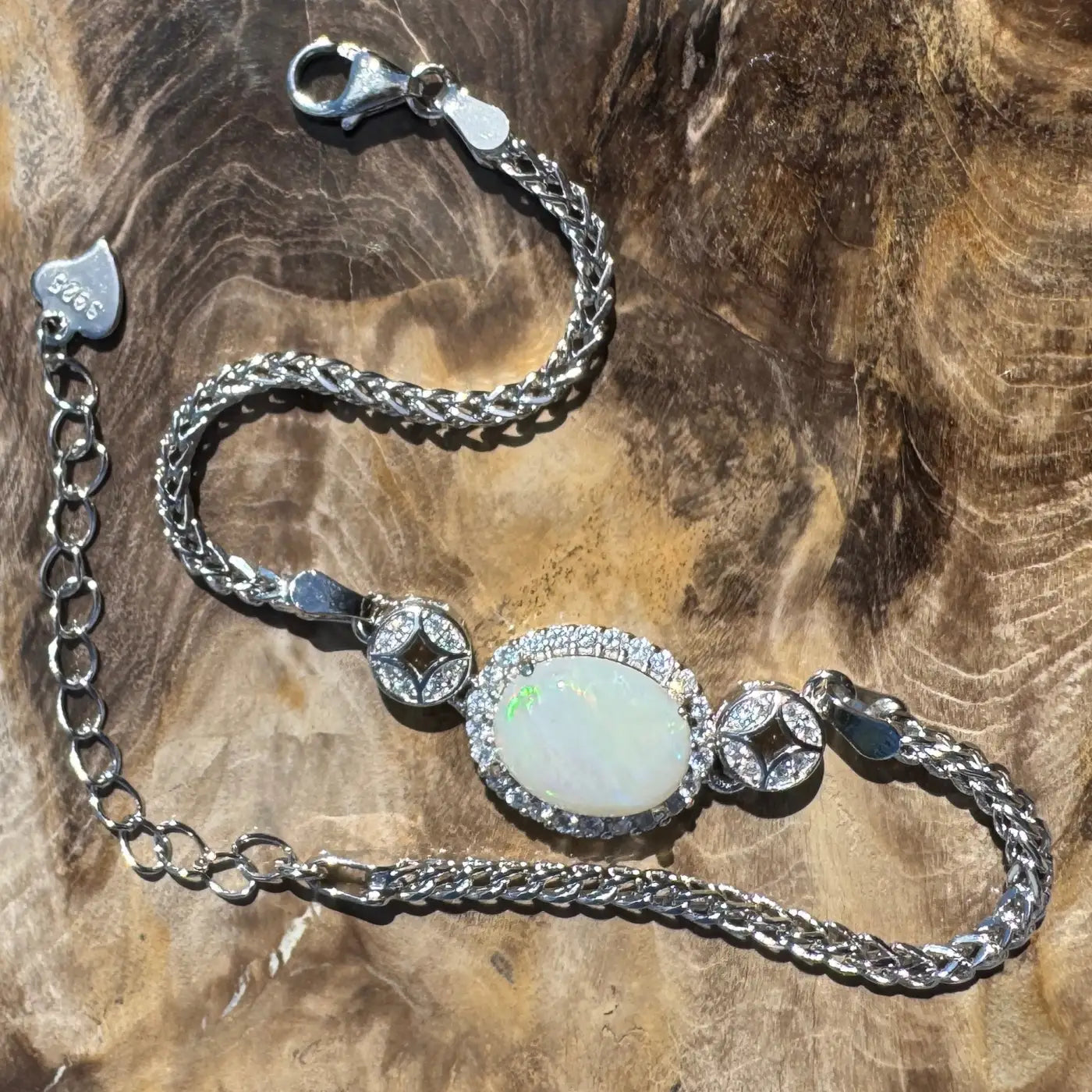 Silver opal bracelet featuring a 1.1-carat Coober Pedy opal and cubic zirconia accents