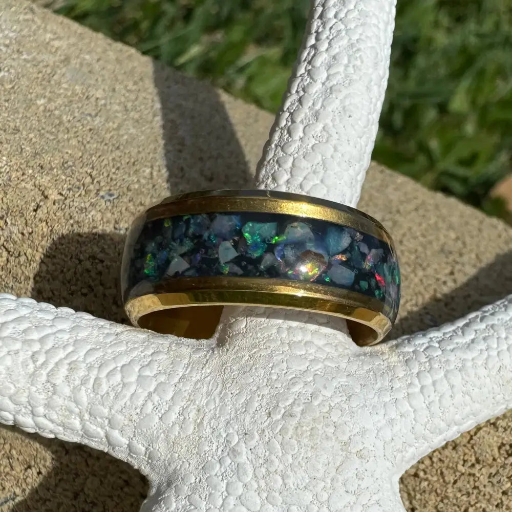 Gold-banded Australian Opal ring displayed in handcrafted jewelry with gold surgical steel size L