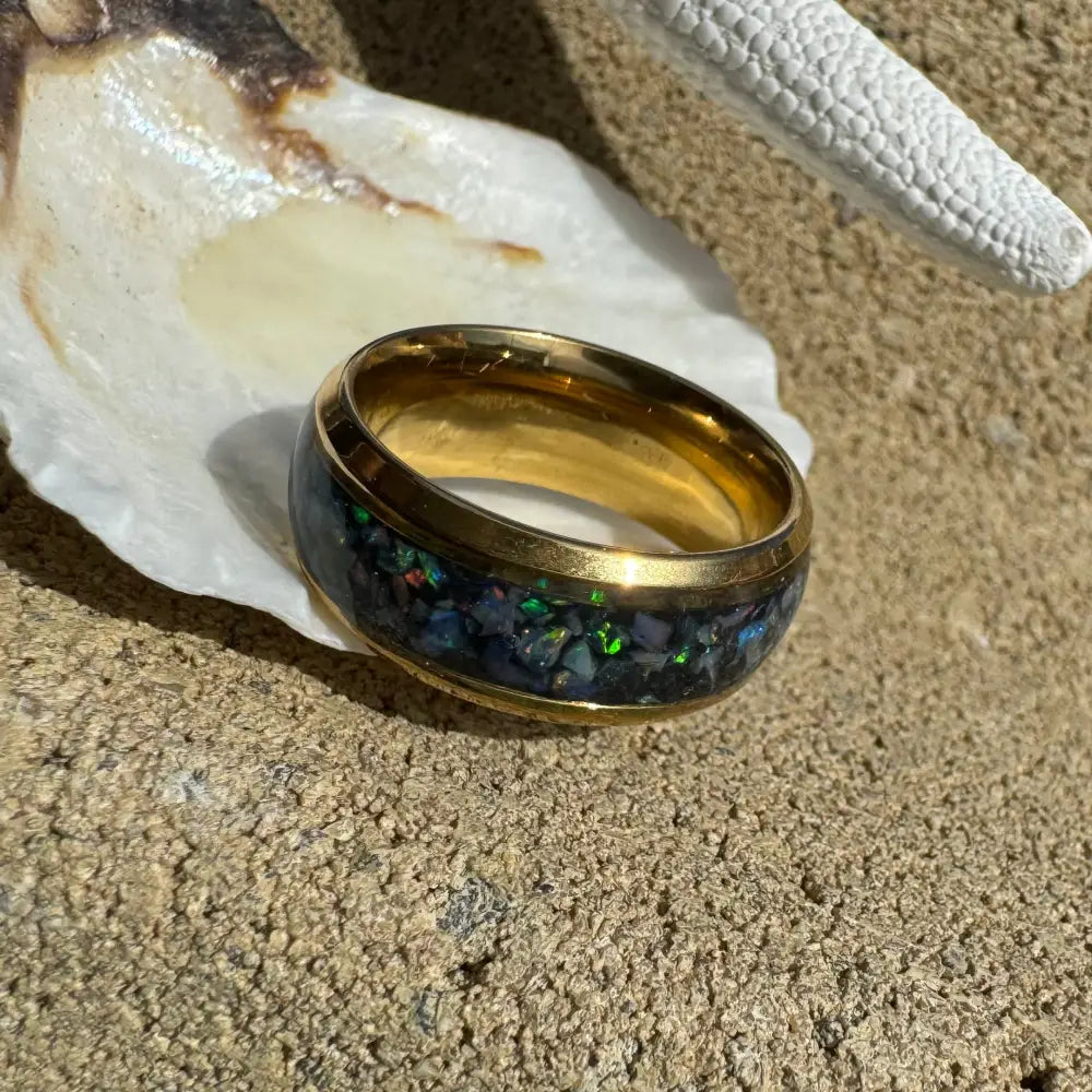 Gold-banded Australian opal ring displayed in handcrafted gold surgical steel size N 7