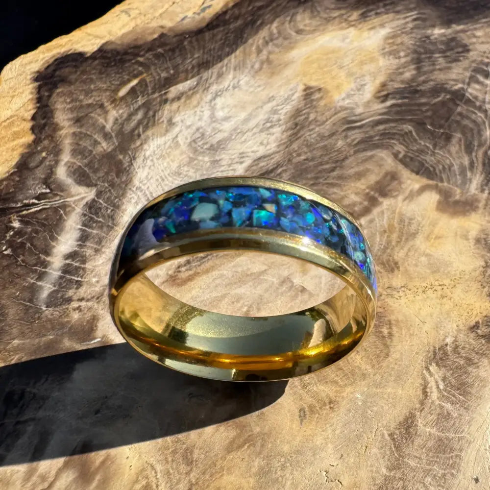 Gold ring with blue opal inlay from Handcrafted Australian Opal Ring Gold Surgical Steel Size V