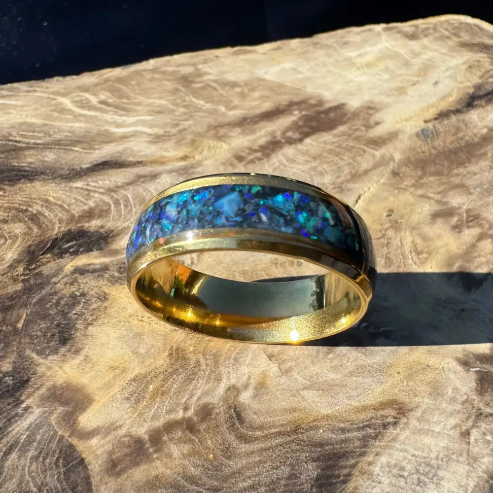 Gold ring with blue Australian opal inlay from Handcrafted Australian Opal Ring Collection