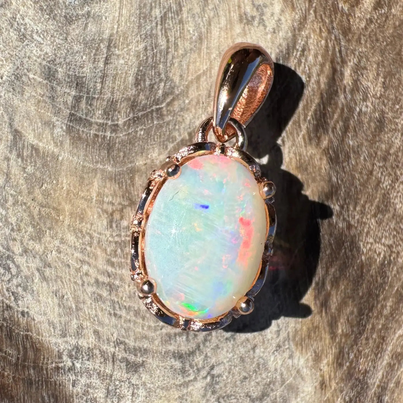 Rose gold opal pendant from Larapinta Flame crafted in sterling silver with Coober Pedy opal
