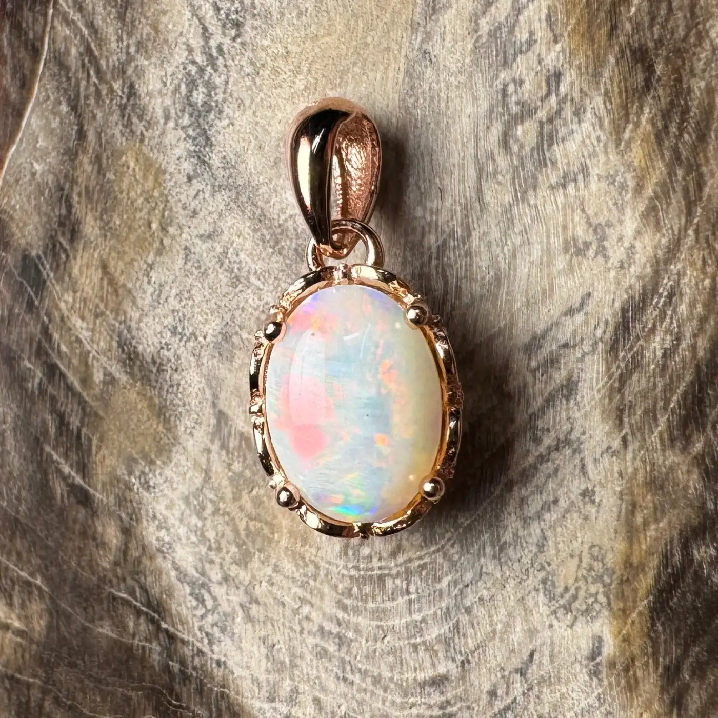 Rose gold opal pendant from Larapinta Flame showcasing handcrafted 0.8ct Coober Pedy opal
