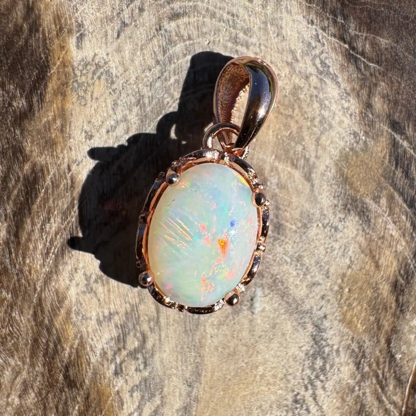 Oval Coober Pedy Opal pendant with rose gold setting in Larapinta Flame collection