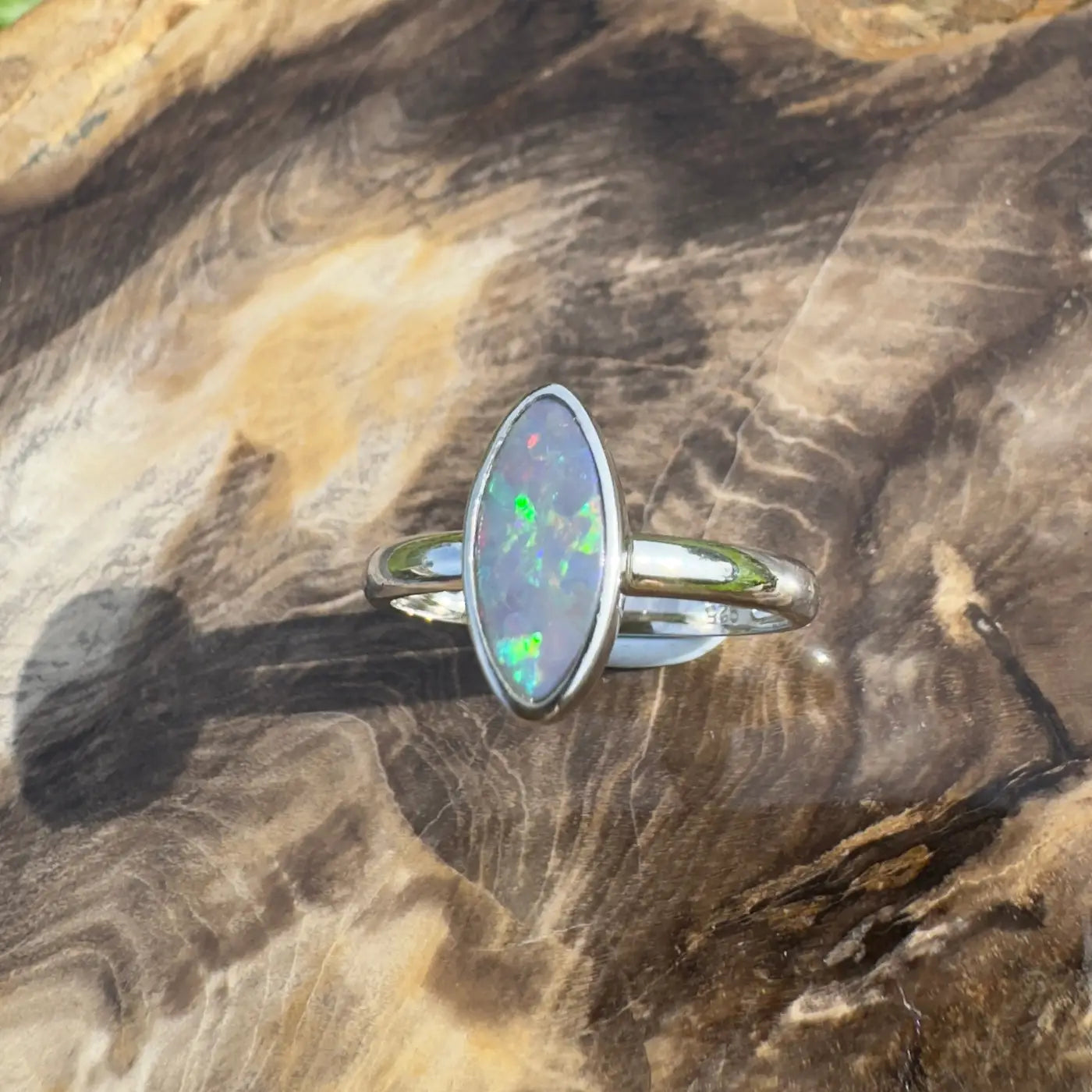 Silver ring with a 0.96ct Lightning Ridge opal gemstone in handcrafted sterling silver design