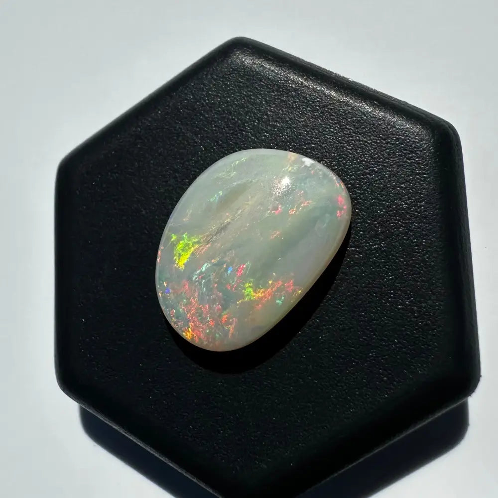Iridescent Lightning Ridge Opal gemstone showcasing vibrant color play and natural brilliance
