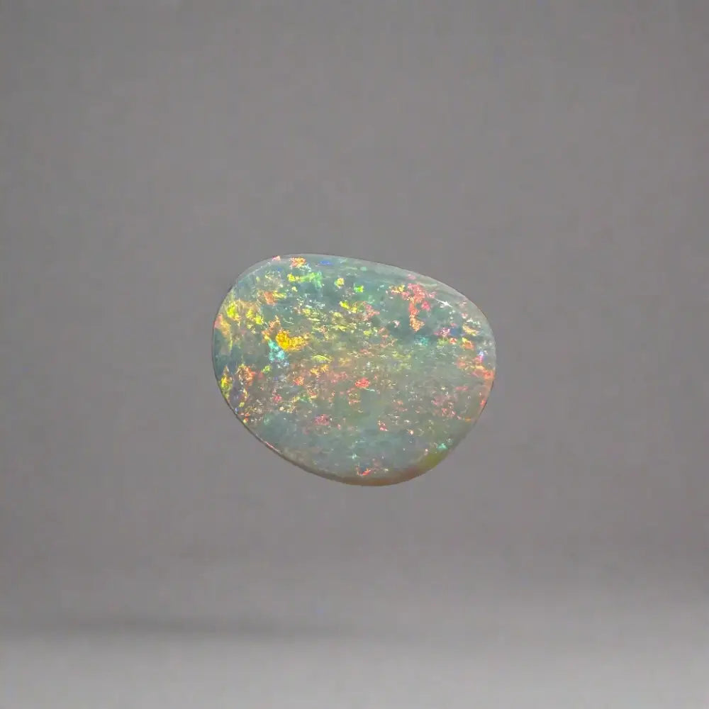 Iridescent opal gemstone from Lightning Ridge in a 2.4 carat solid hand-cut setting