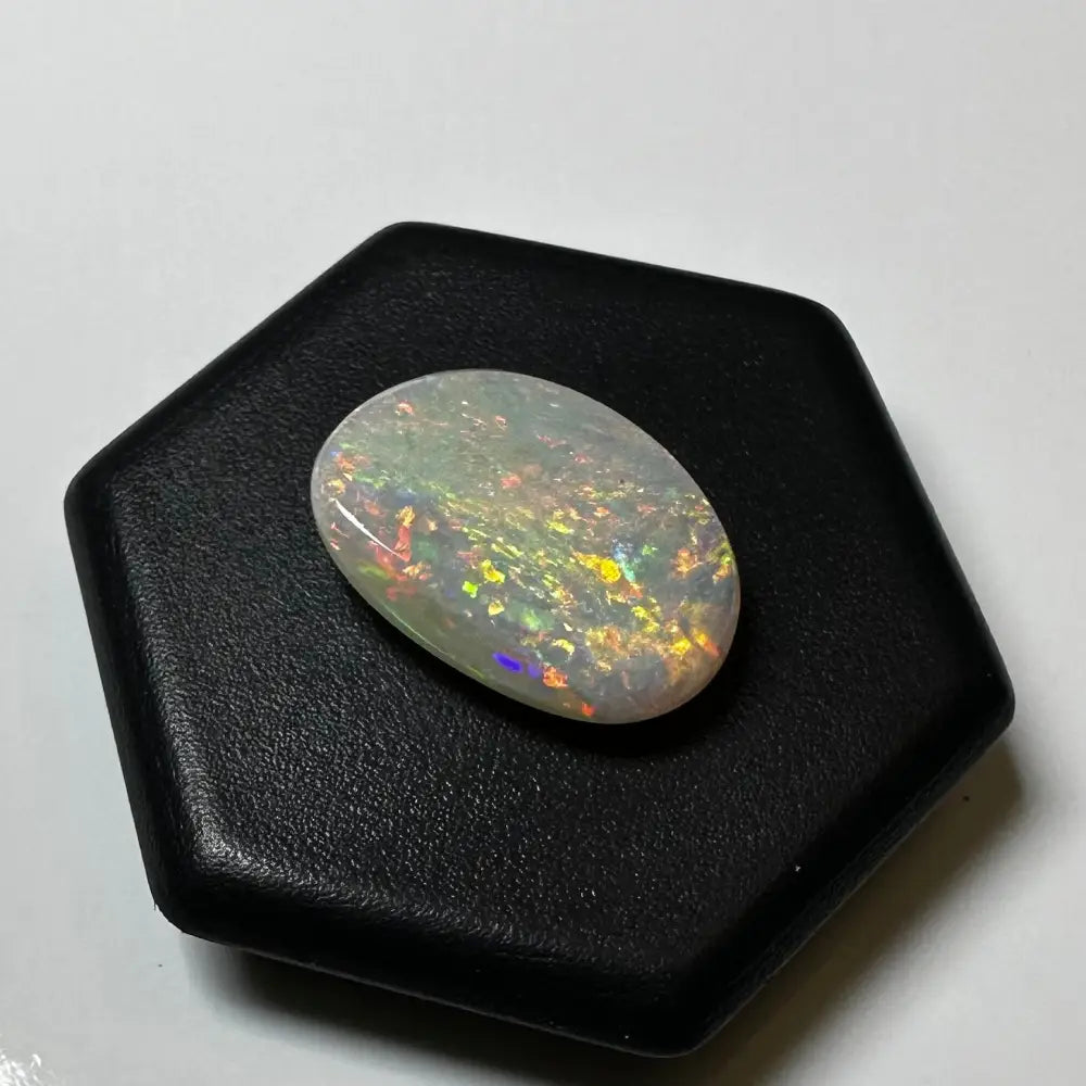Oval opal gemstone with vibrant color play in Lightning Ridge Opal 2.4carat Solid Hand-Cut