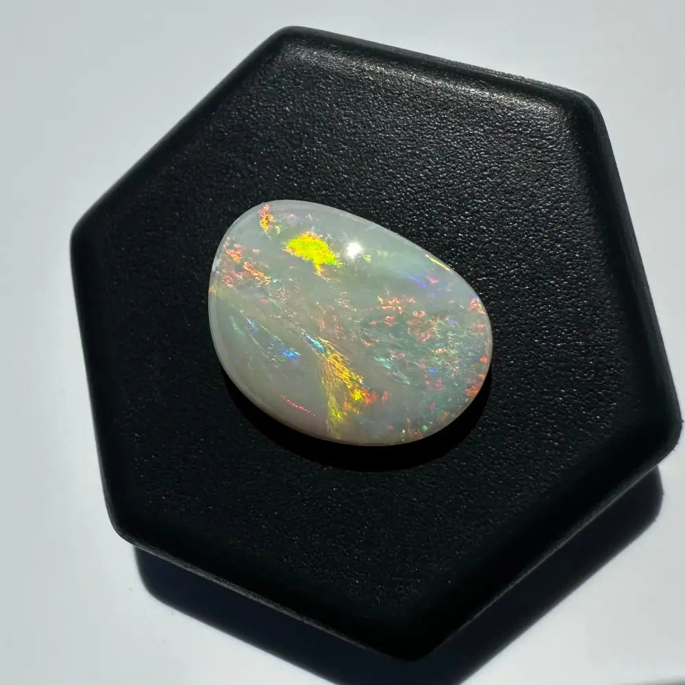 Iridescent Lightning Ridge Opal gemstone in a 2.4 carat solid hand-cut jewelry piece