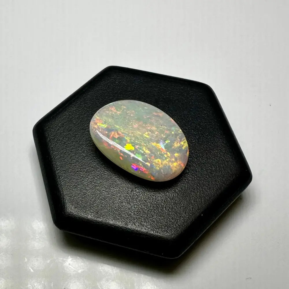 Oval opal gemstone with vibrant play-of-color from Lightning Ridge Opal 2.4 carat solid hand-cut