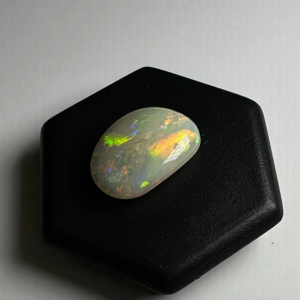 Iridescent oval opal gemstone from Lightning Ridge 2.4 carats solid hand-cut product