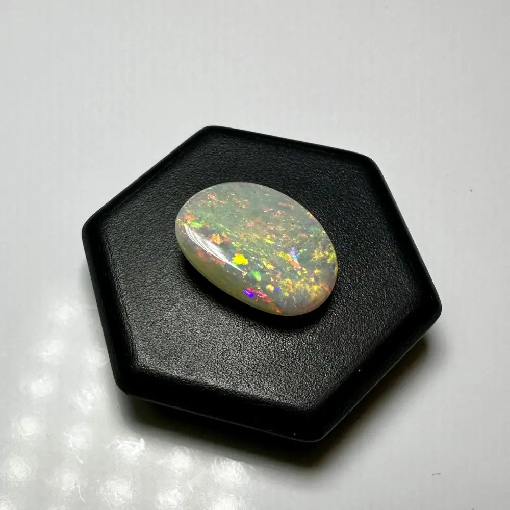Oval opal gemstone with iridescent play-of-color in Lightning Ridge Opal 2.4carat solid hand-cut jewelry