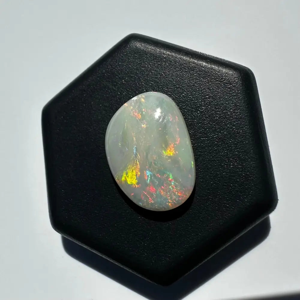 Iridescent white opal gemstone from Lightning Ridge in a 2.4 Carat Solid Hand-Cut setting