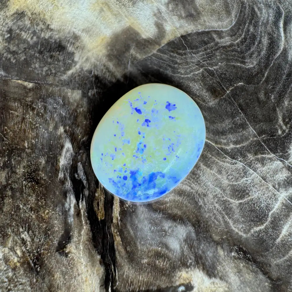 Oval opal with blue inclusions in the Lightning Ridge Opal 3.5carat solid hand-cut gemstone