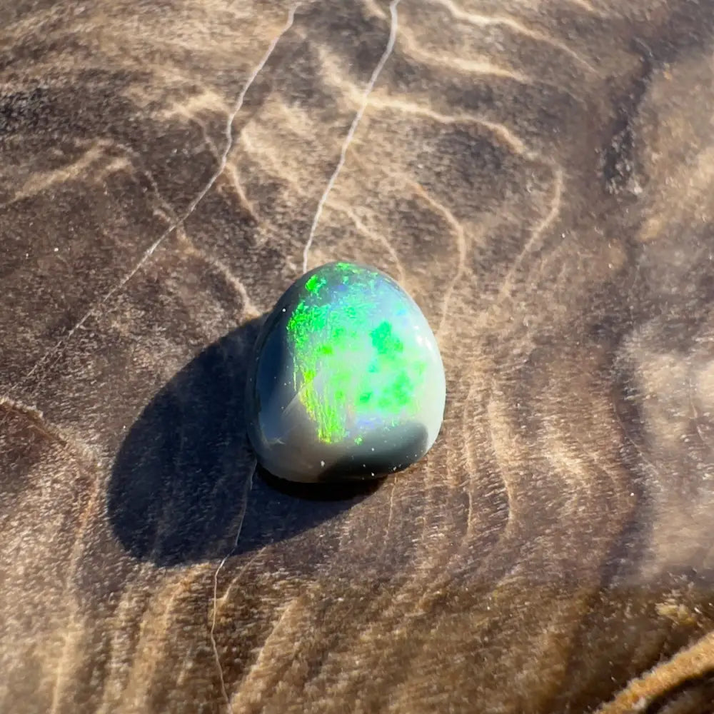 Iridescent green opal cabochon from Lightning Ridge Semi Black Opal 0.4 carat