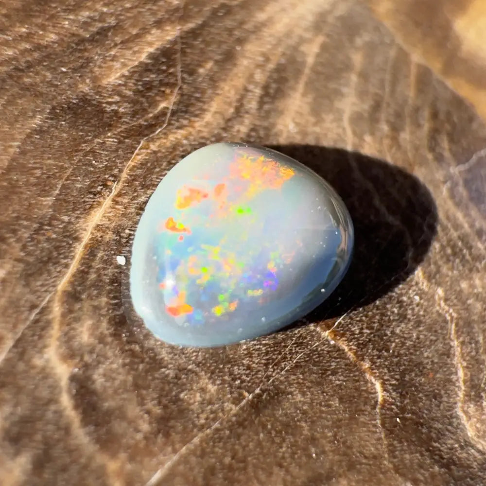 Iridescent opal cabochon from Lightning Ridge Semi Black Opal 0.4 carat solid hand-cut