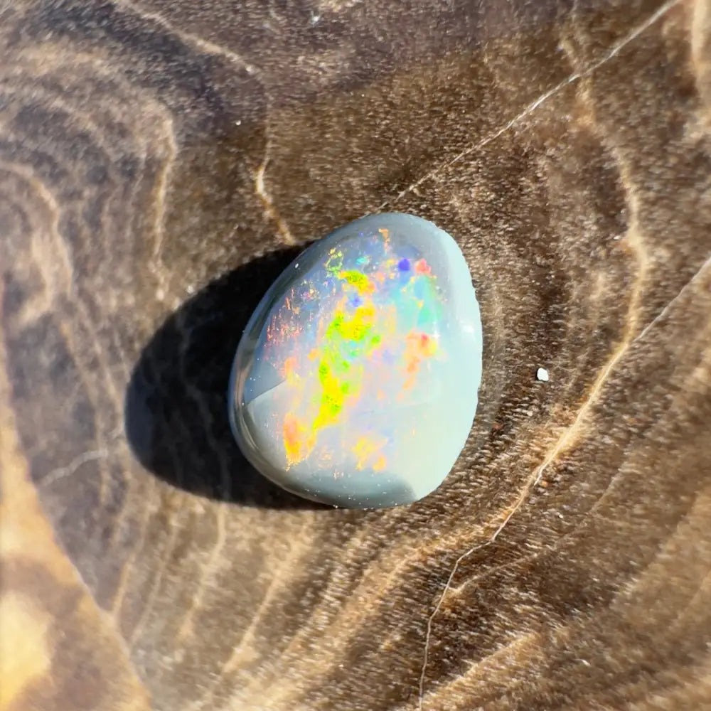 Iridescent opal cabochon from Lightning Ridge Semi Black Opal 0.4 carat hand-cut gemstone