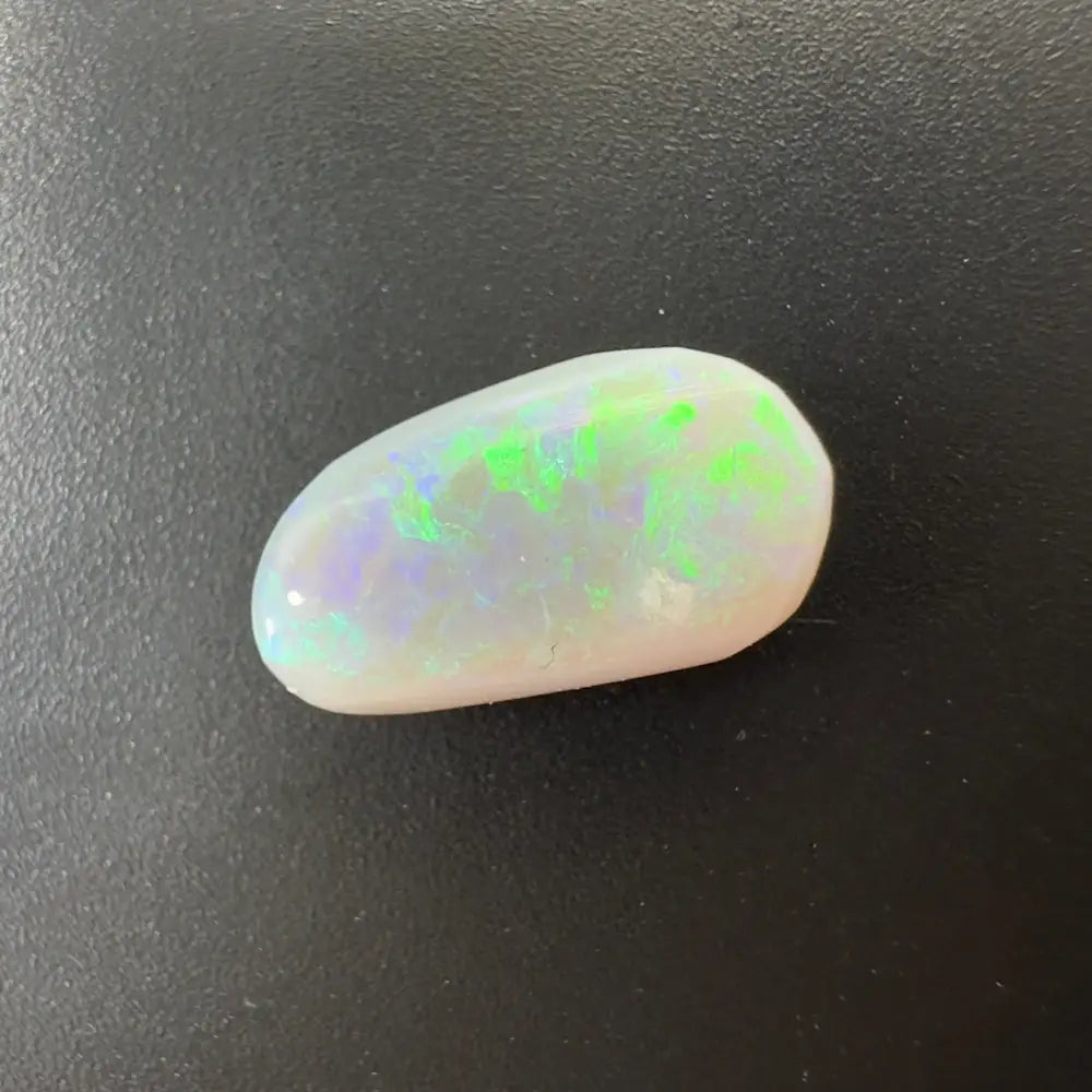 Iridescent Lightning Ridge Semi Black Opal gemstone showcasing vibrant play of color
