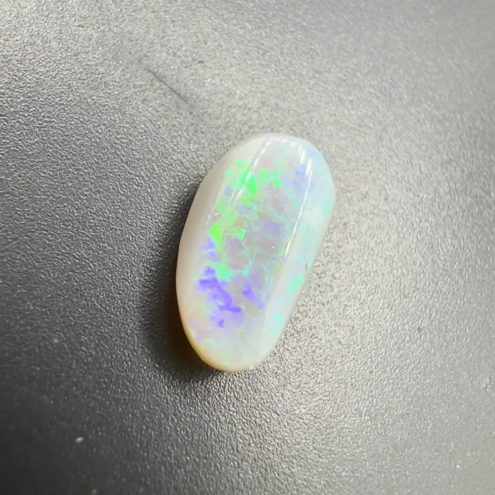 Iridescent Lightning Ridge Semi Black Opal gemstone showcasing vibrant play-of-color and craftsmanship