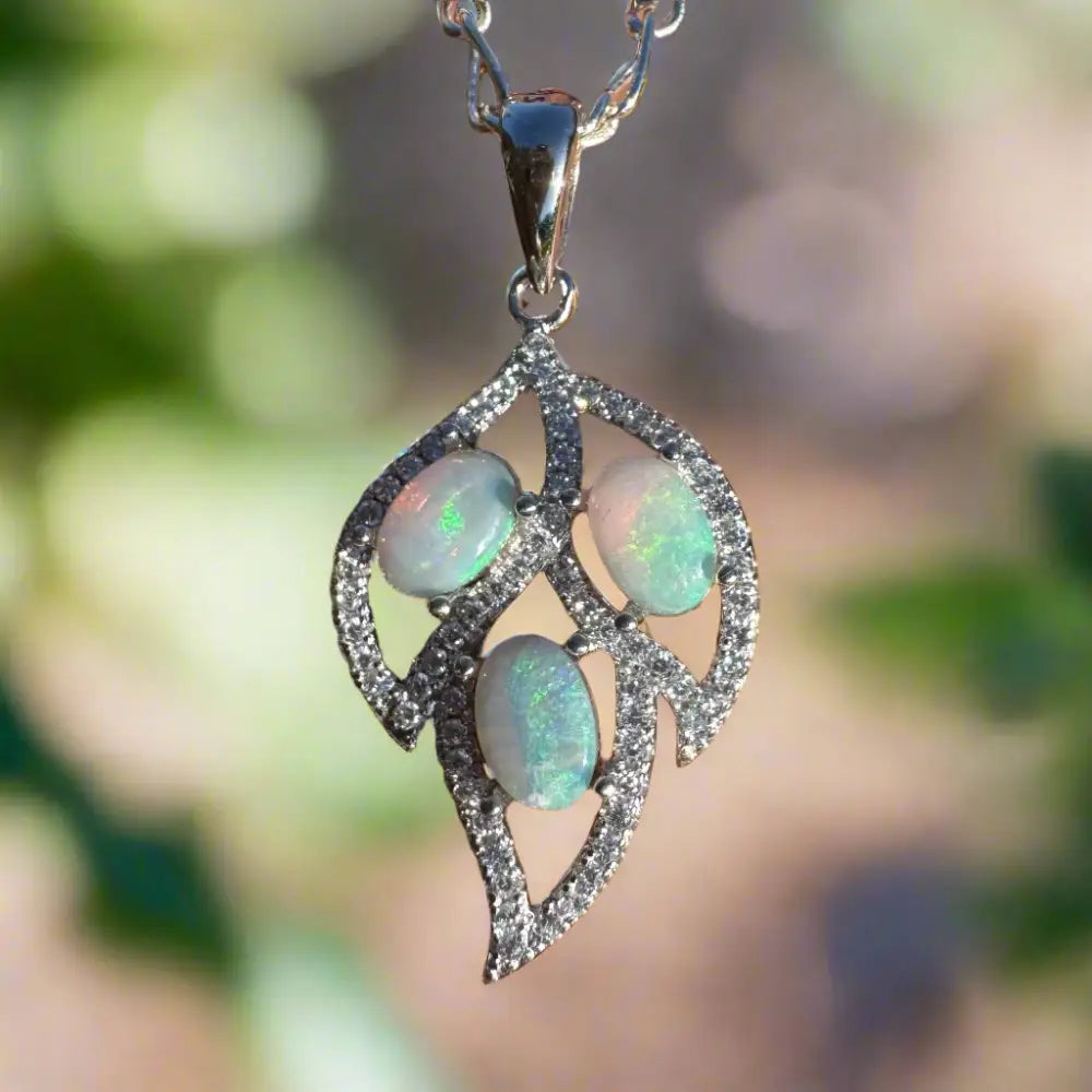 Leaf-shaped opal and diamond pendant crafted in sterling silver with lightning Ridge opal