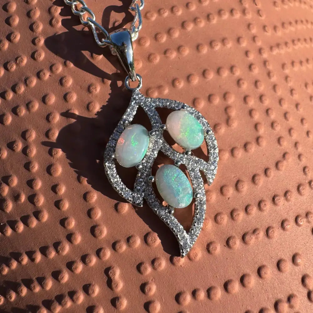 Leaf-shaped opal and diamond pendant from New Leaf collection featuring sterling silver craftsmanship