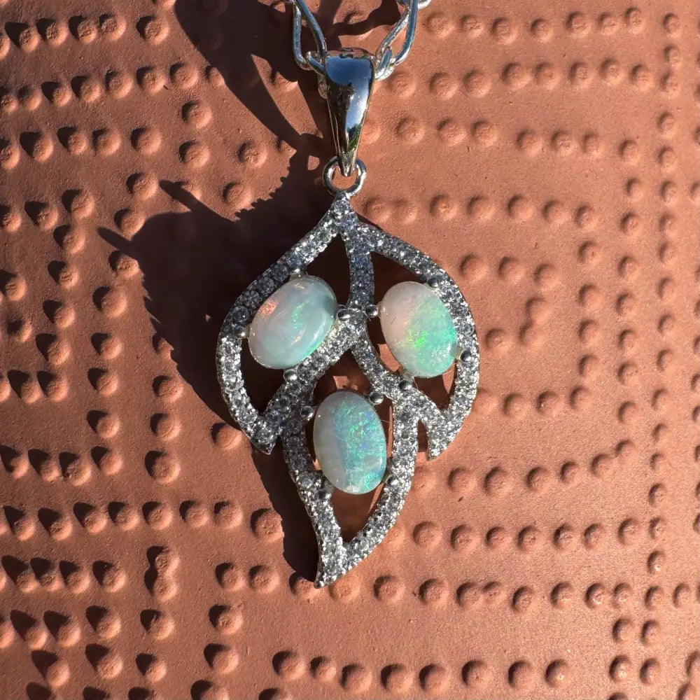 Silver leaf pendant with three opals from the New Leaf handcrafted jewelry collection