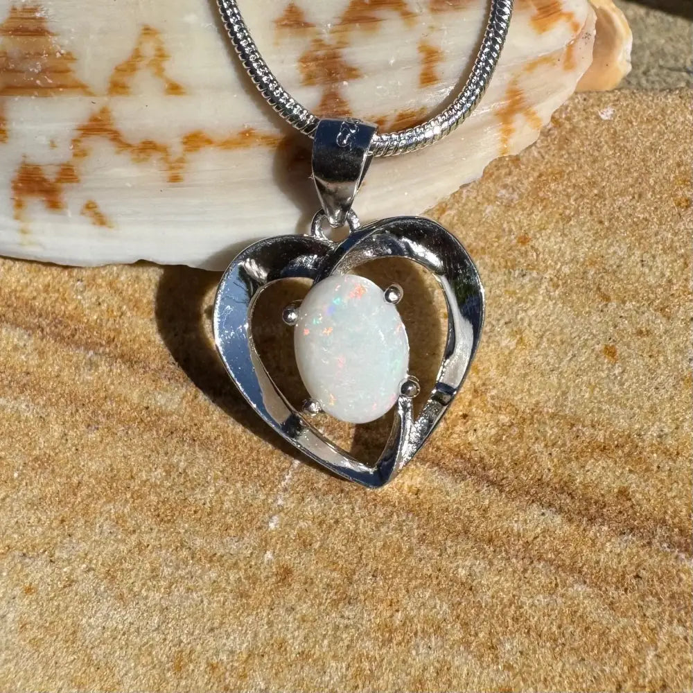 Silver heart pendant with a 0.9ct Coober Pedy opal in a handcrafted sterling silver necklace