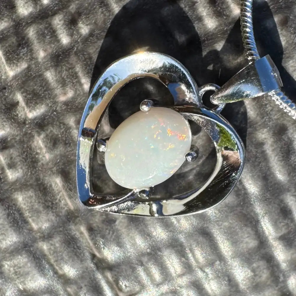 Heart-shaped opal pendant from Opal Love featuring a 0.9ct Coober Pedy opal in sterling silver