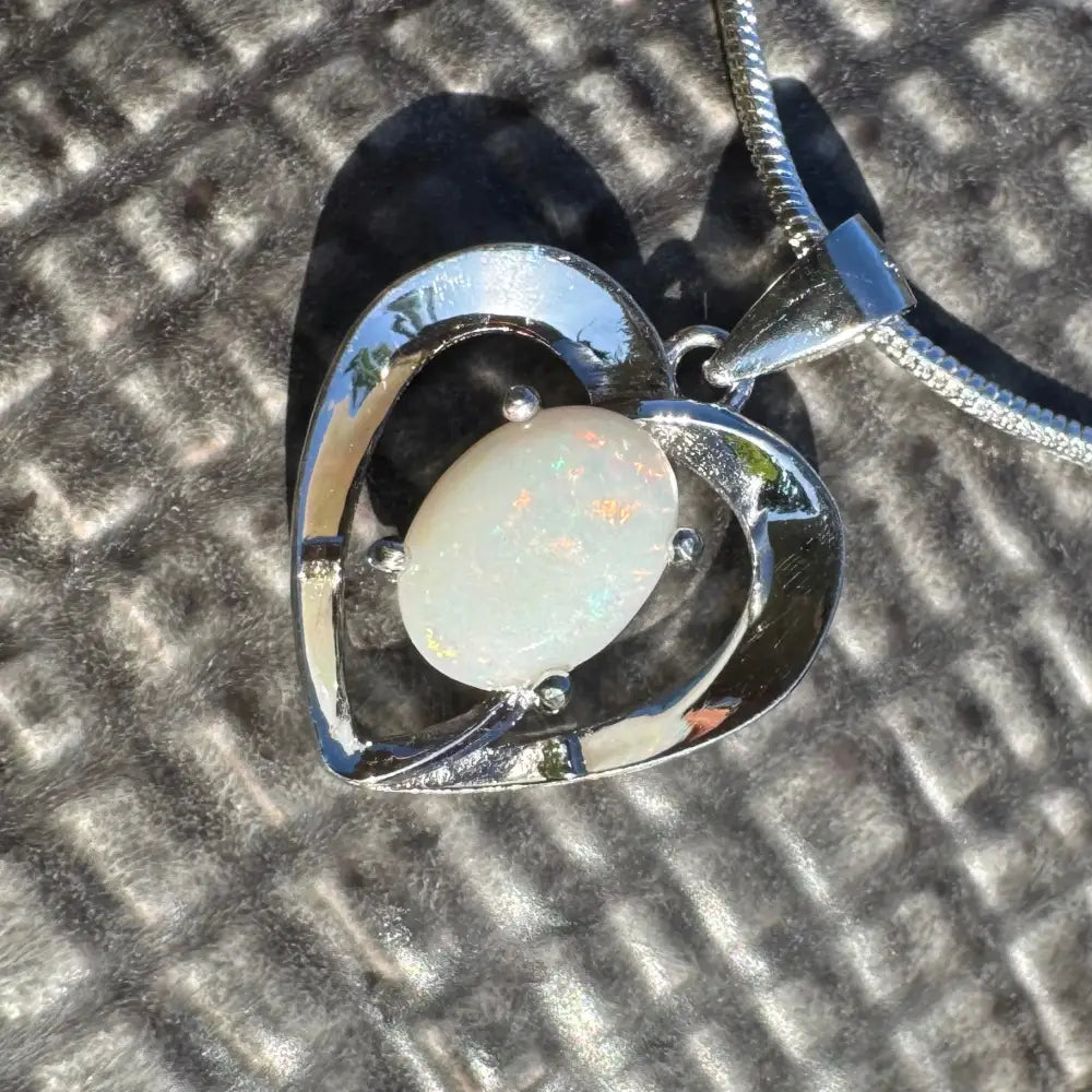 Silver heart pendant with a 0.9ct Coober Pedy Opal in a handcrafted Sterling Silver necklace