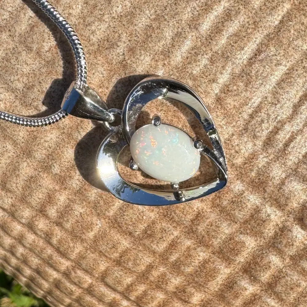 Heart-shaped opal pendant in sterling silver from the Opal Love handcrafted necklace collection
