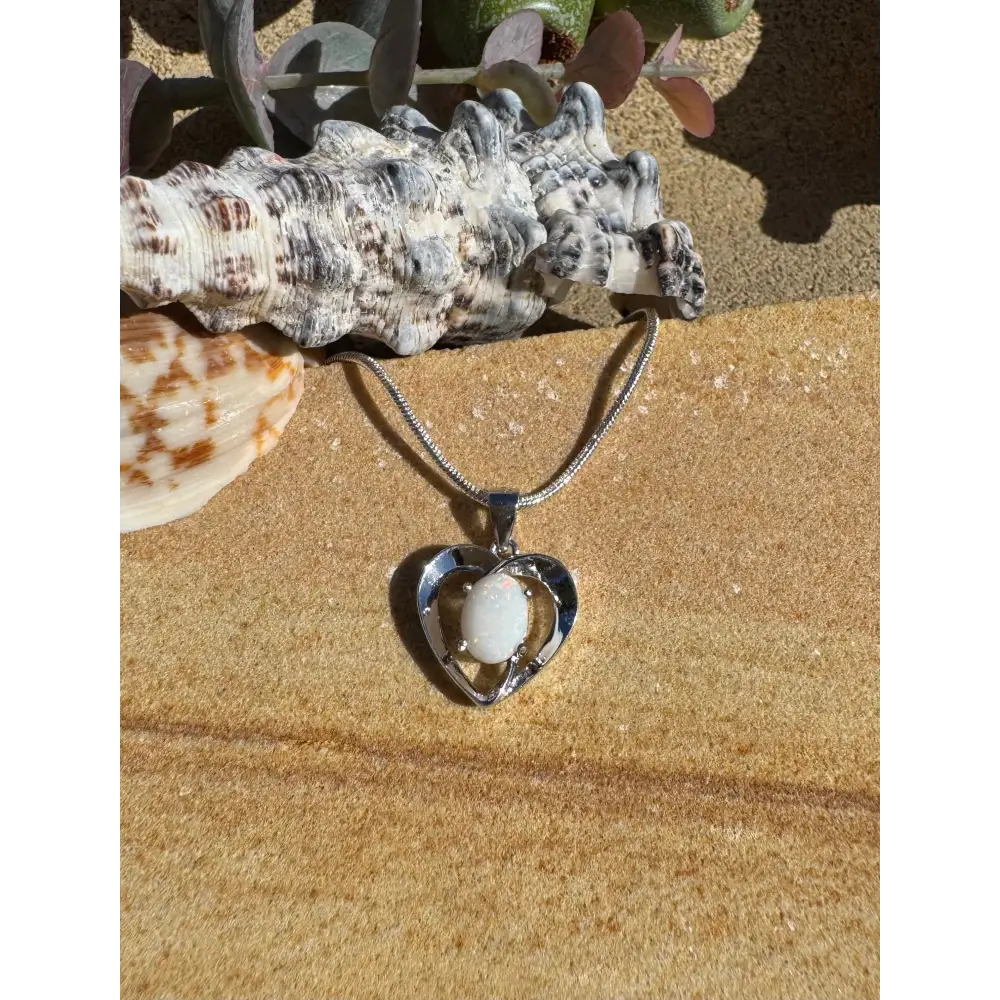 Heart-shaped pendant necklace featuring a white stone in handcrafted Coober Pedy Opal silver jewelry