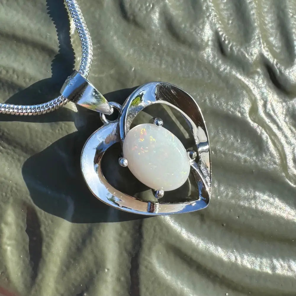 Silver heart pendant featuring a handcrafted 0.9ct Coober Pedy Opal in sterling silver