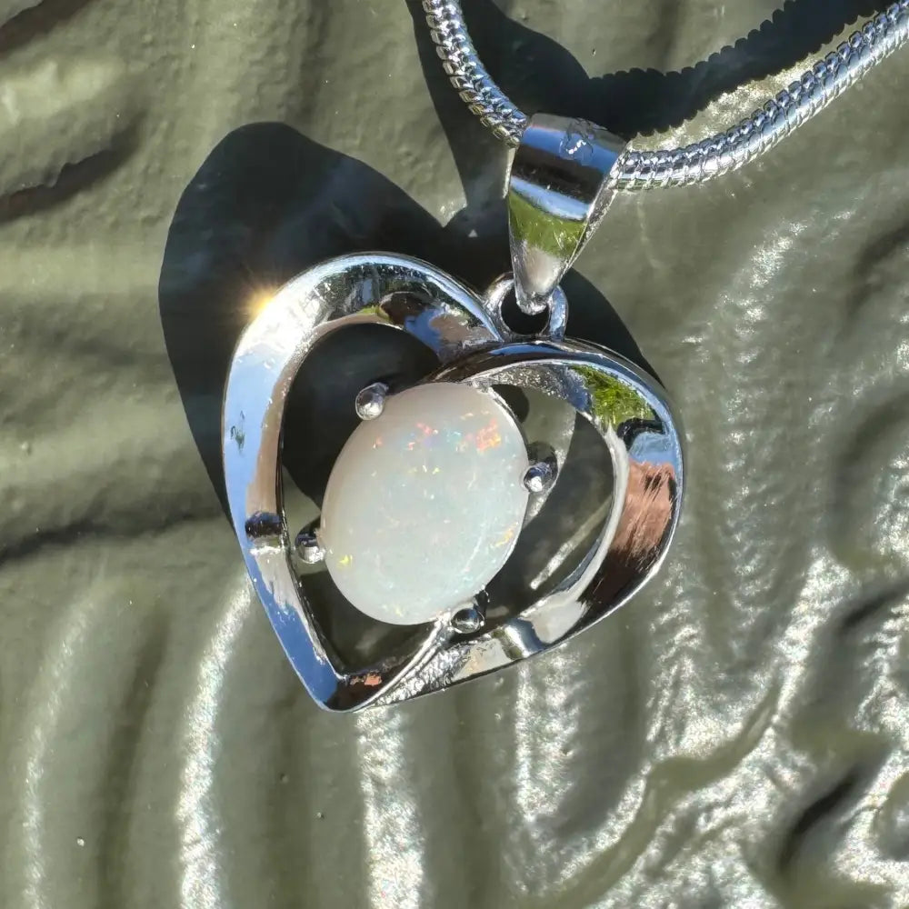 Silver heart pendant with a 0.9ct Coober Pedy opal in a handcrafted sterling silver necklace