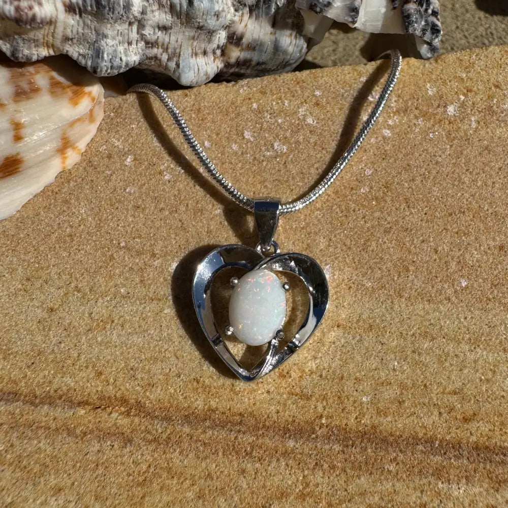Silver heart pendant with a 0.9ct Coober Pedy Opal in a handcrafted sterling silver necklace