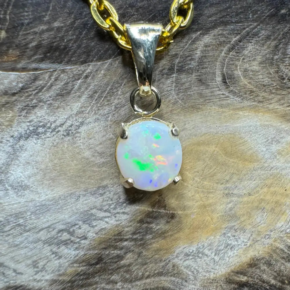 Opal pendant with gold chain from Outback Dreams showcasing a handcrafted 9ct solid gold Coober Pedy Opal