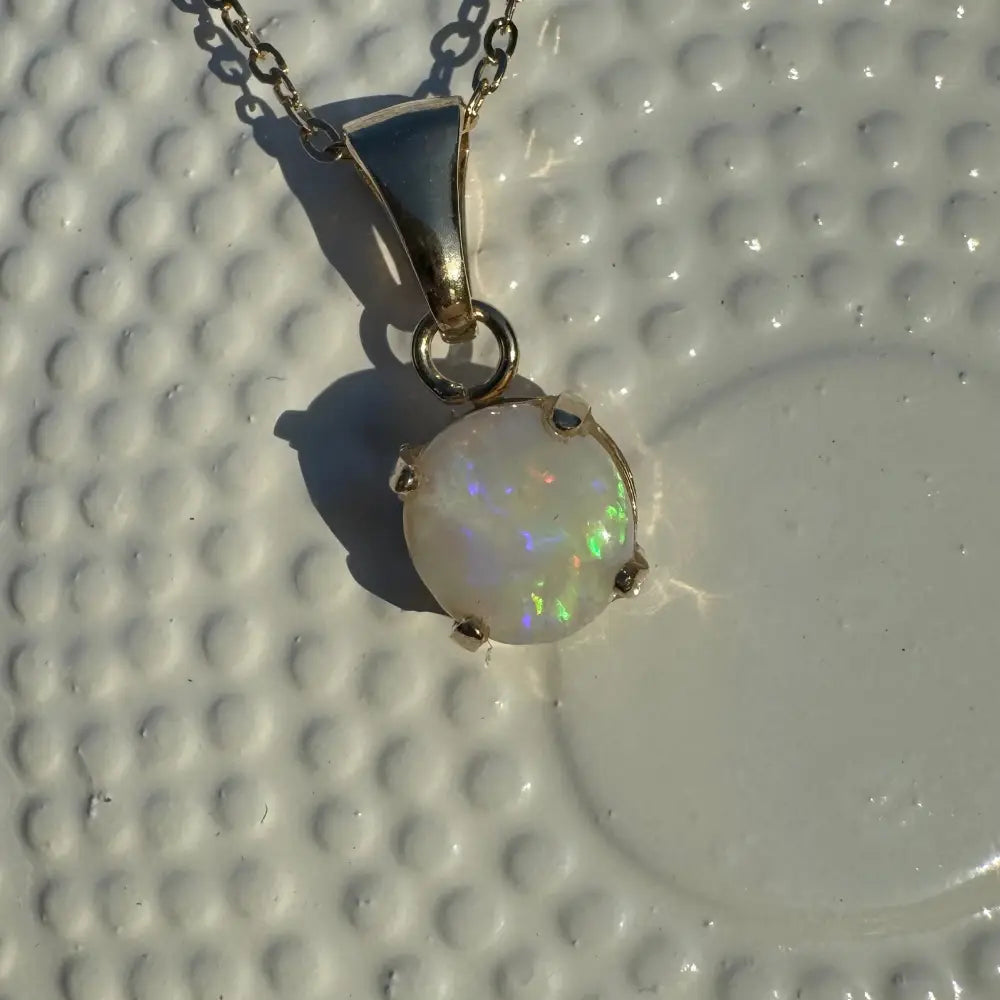 Silver necklace with iridescent Coober Pedy opal pendant from Outback Dreams collection