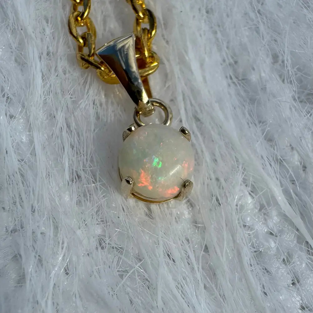 Opal pendant with gold chain from Outback Fire featuring 9ct solid gold and Coober Pedy opal