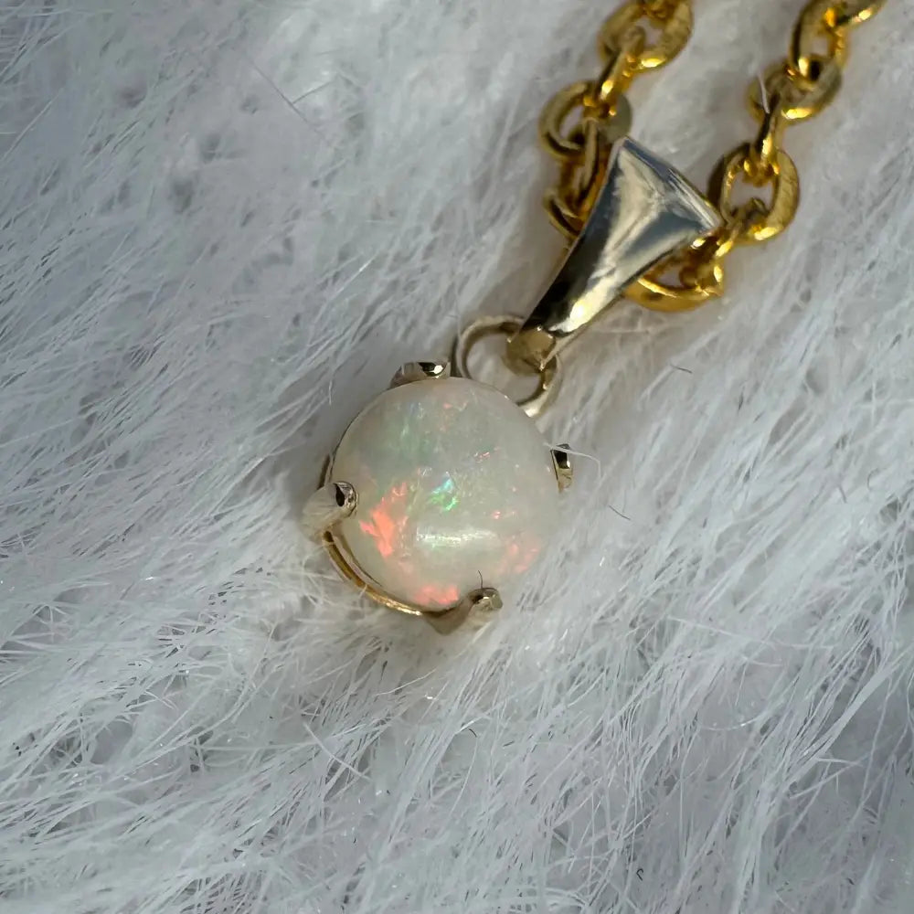 Gold chain necklace with a Coober Pedy opal pendant from Outback Fire collection