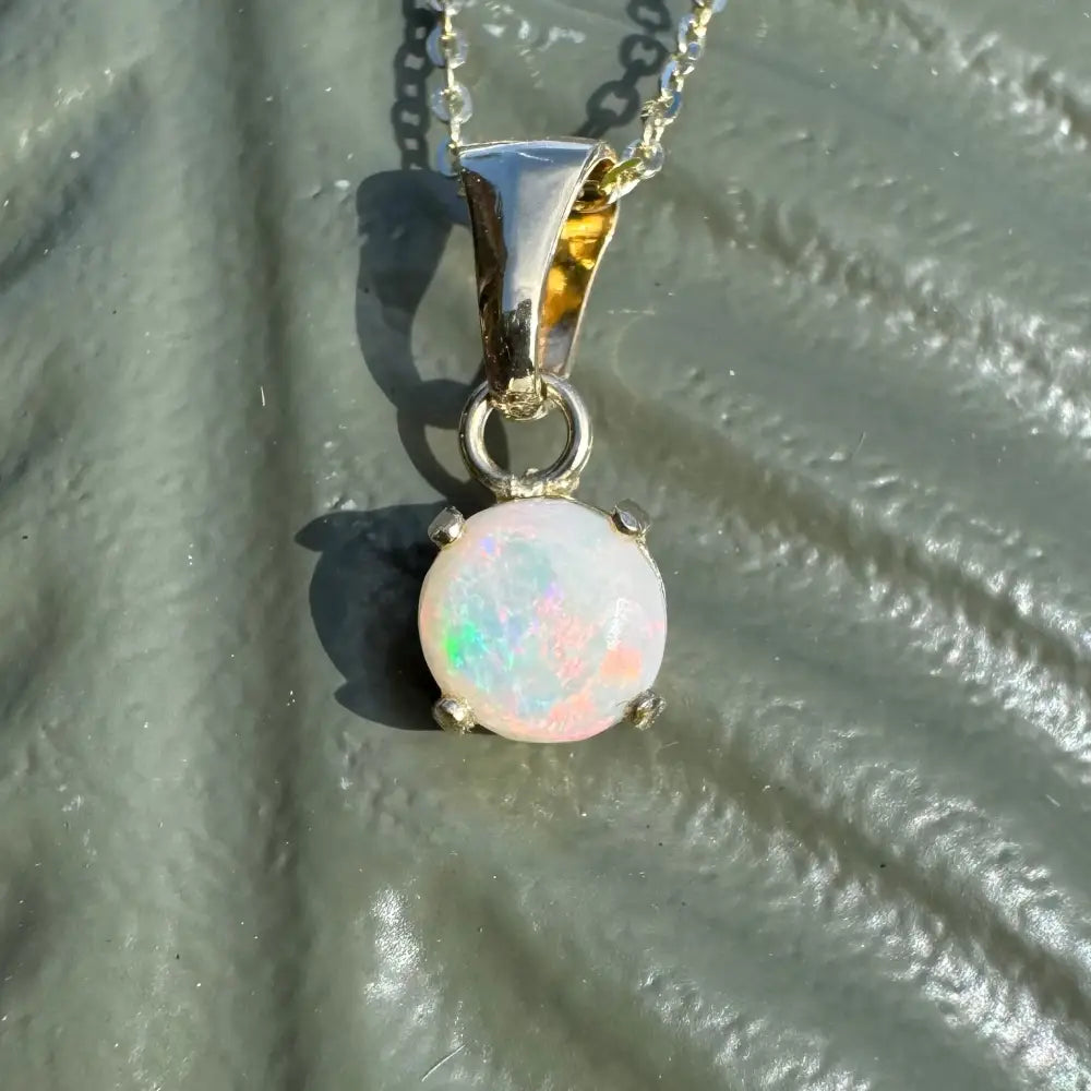 Handcrafted 9ct solid gold opal pendant necklace featuring a 0.8ct Coober Pedy opal