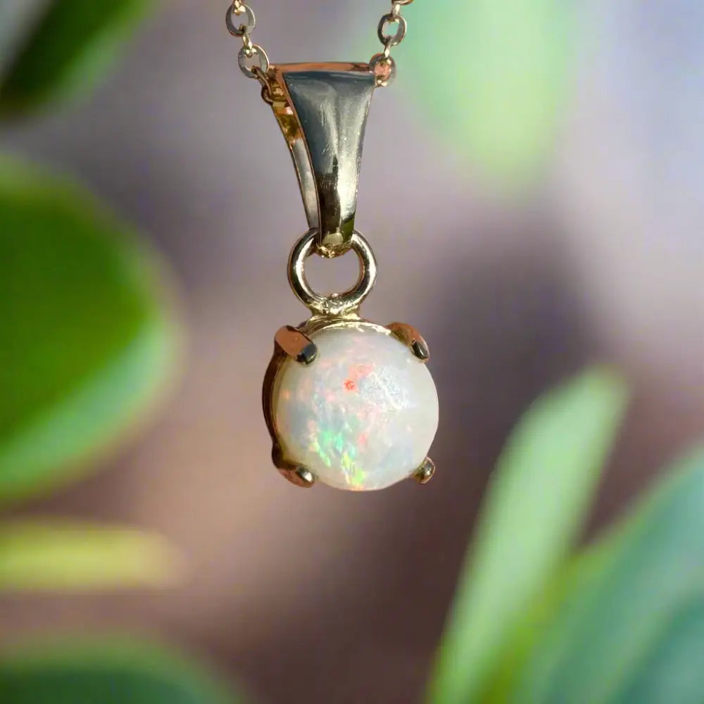 Gold opal pendant necklace named Outback Fire featuring a handcrafted 9ct solid gold Coober Pedy opal pendant